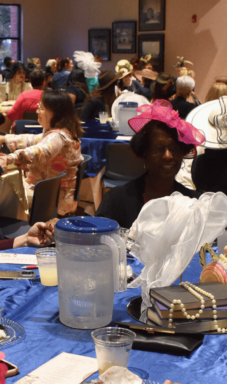 A room full of ladies having lunch together.